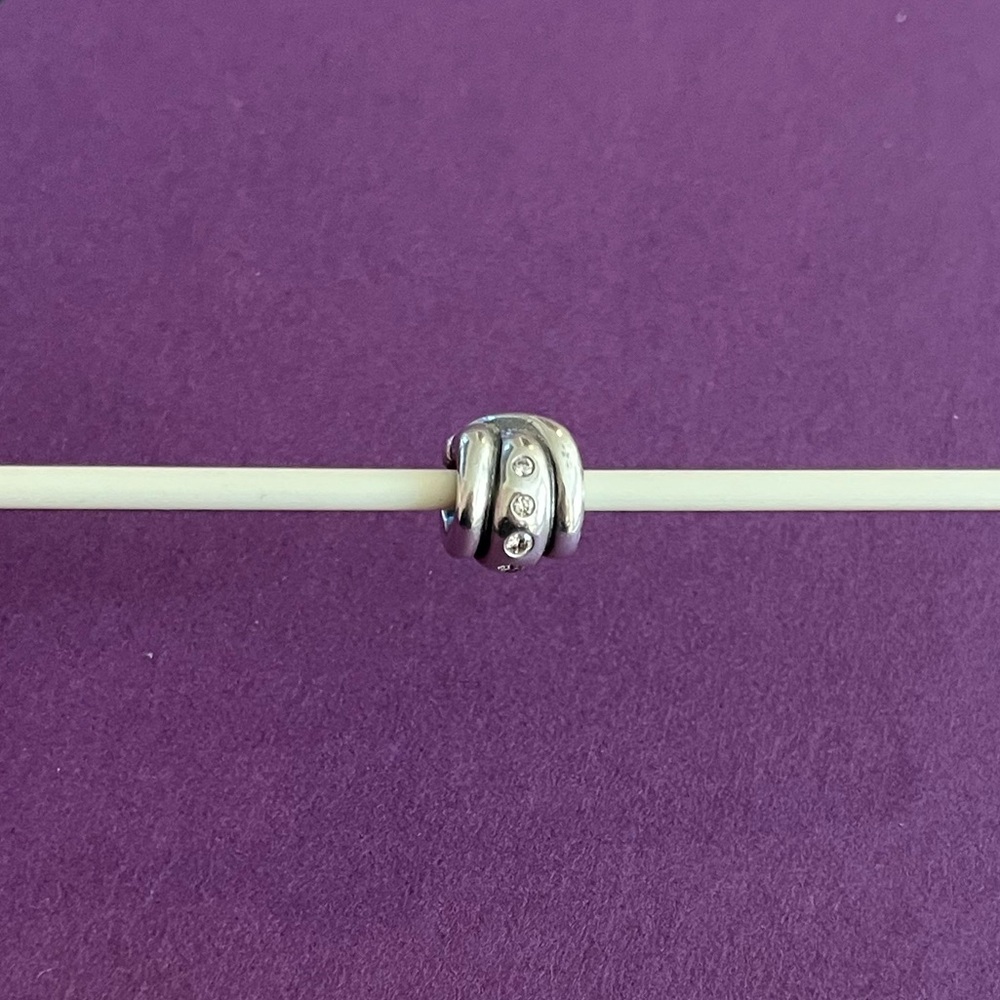 Pandora Retired Champagne Swirl Sterling Silver charm with CZ stones.